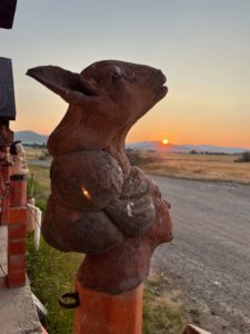 Sculptural figure with sunset