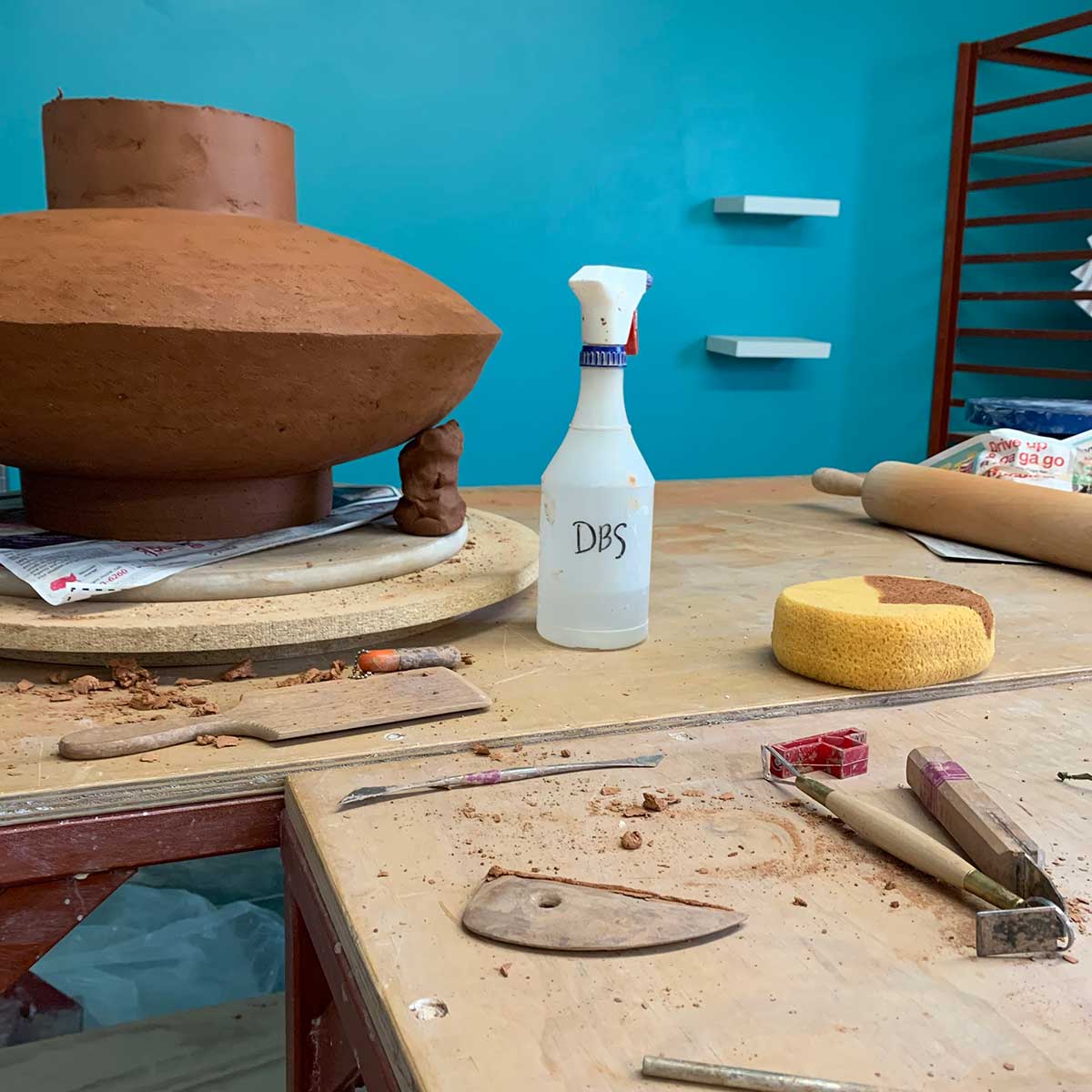 Clay pot in the making in a studio with tools
