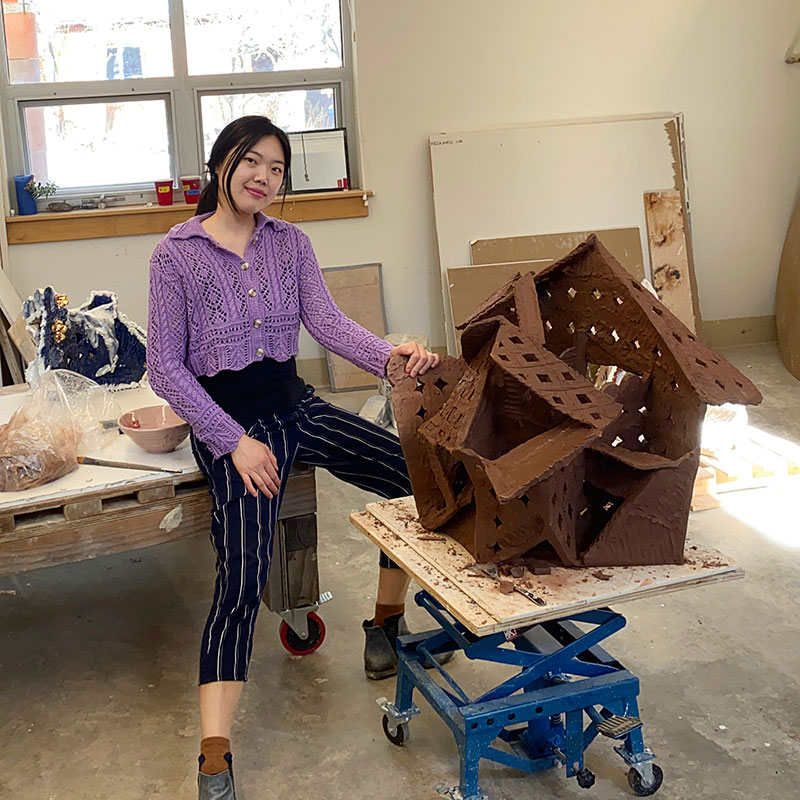 Long-term Resident Yeh Rim Lee in Studio with art work