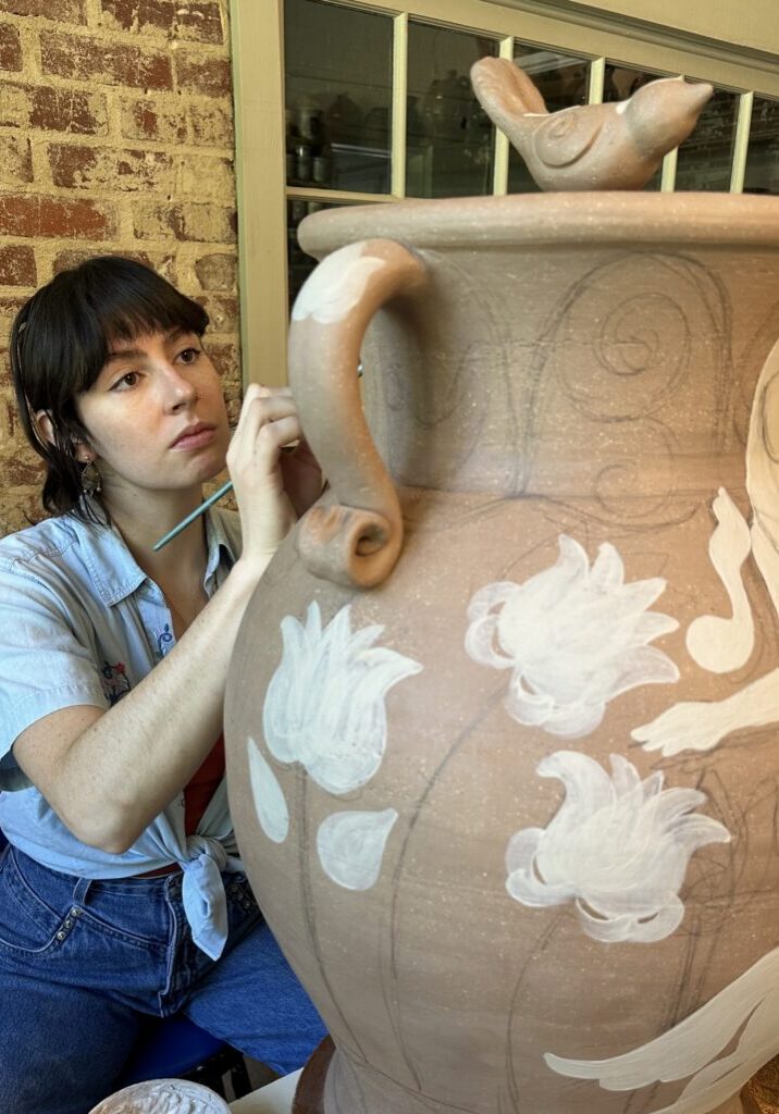 Ari decorating a big potJPG (1)